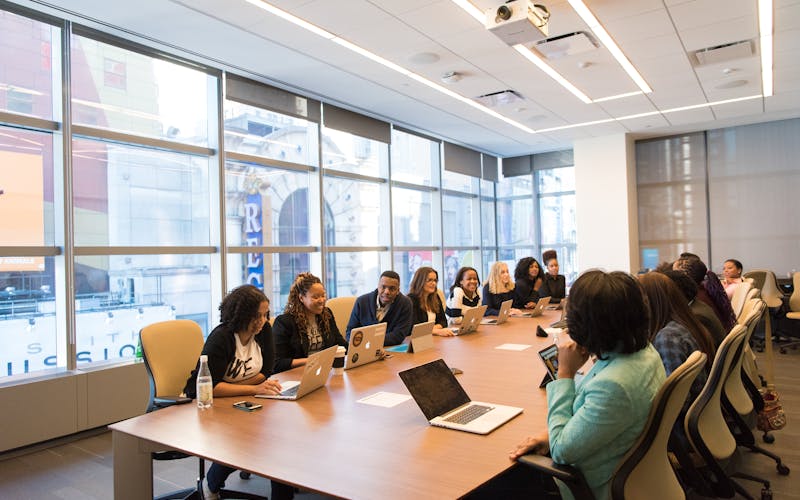 A group reviewing information together at a conference table